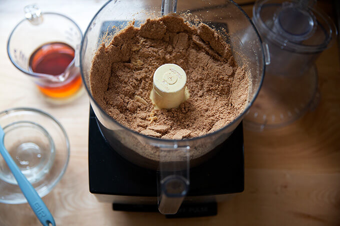 Dry ingredients for rum balls pulsed together in a food processor.